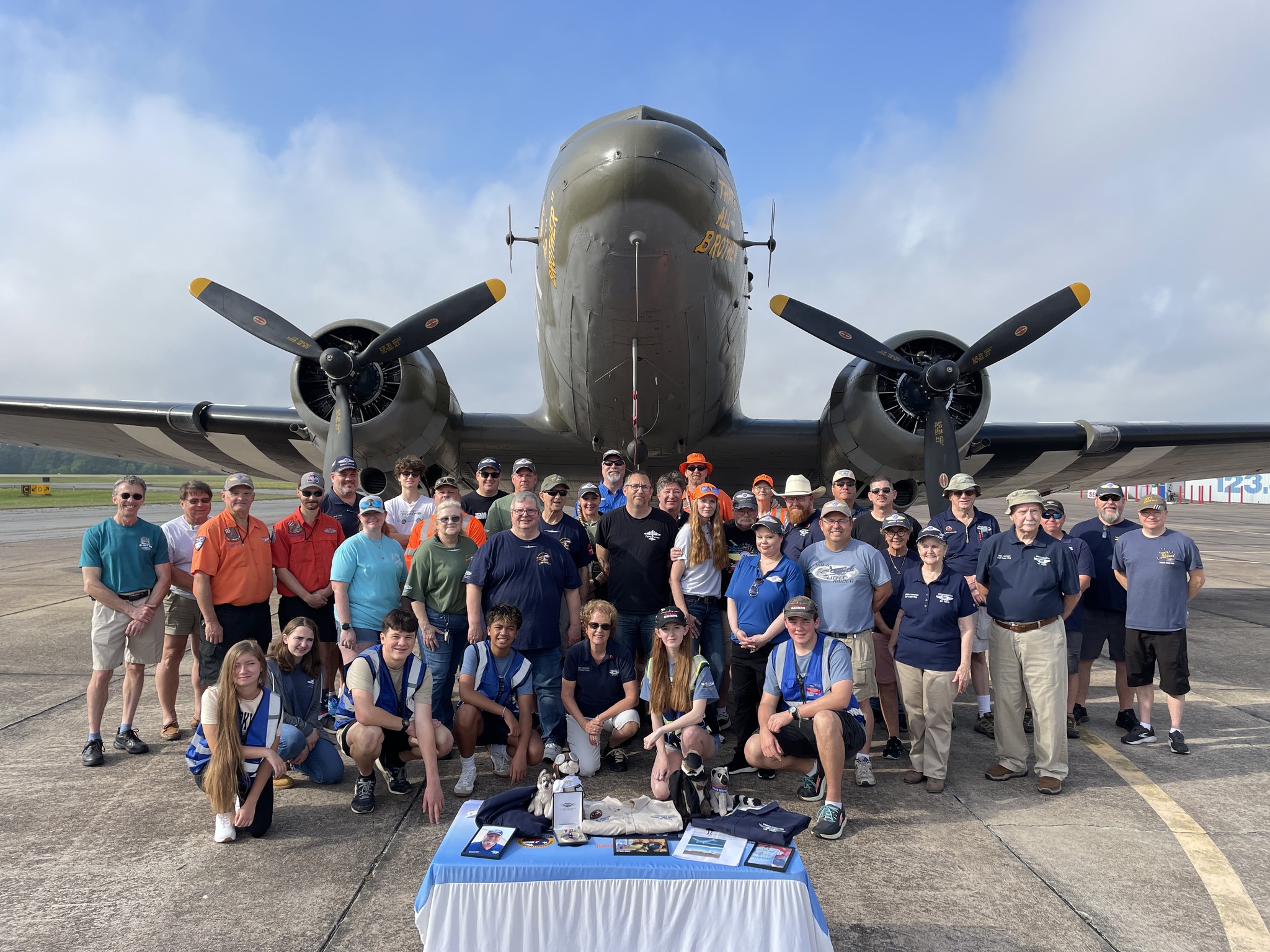 Photo of GCW members with the AC-47