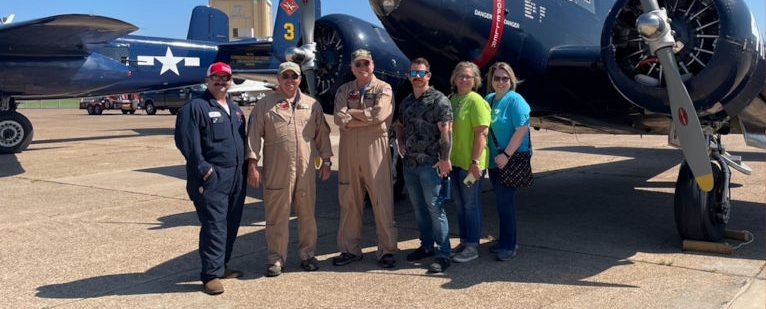 Passengers and Crew Pose in Front of the Twin Beech