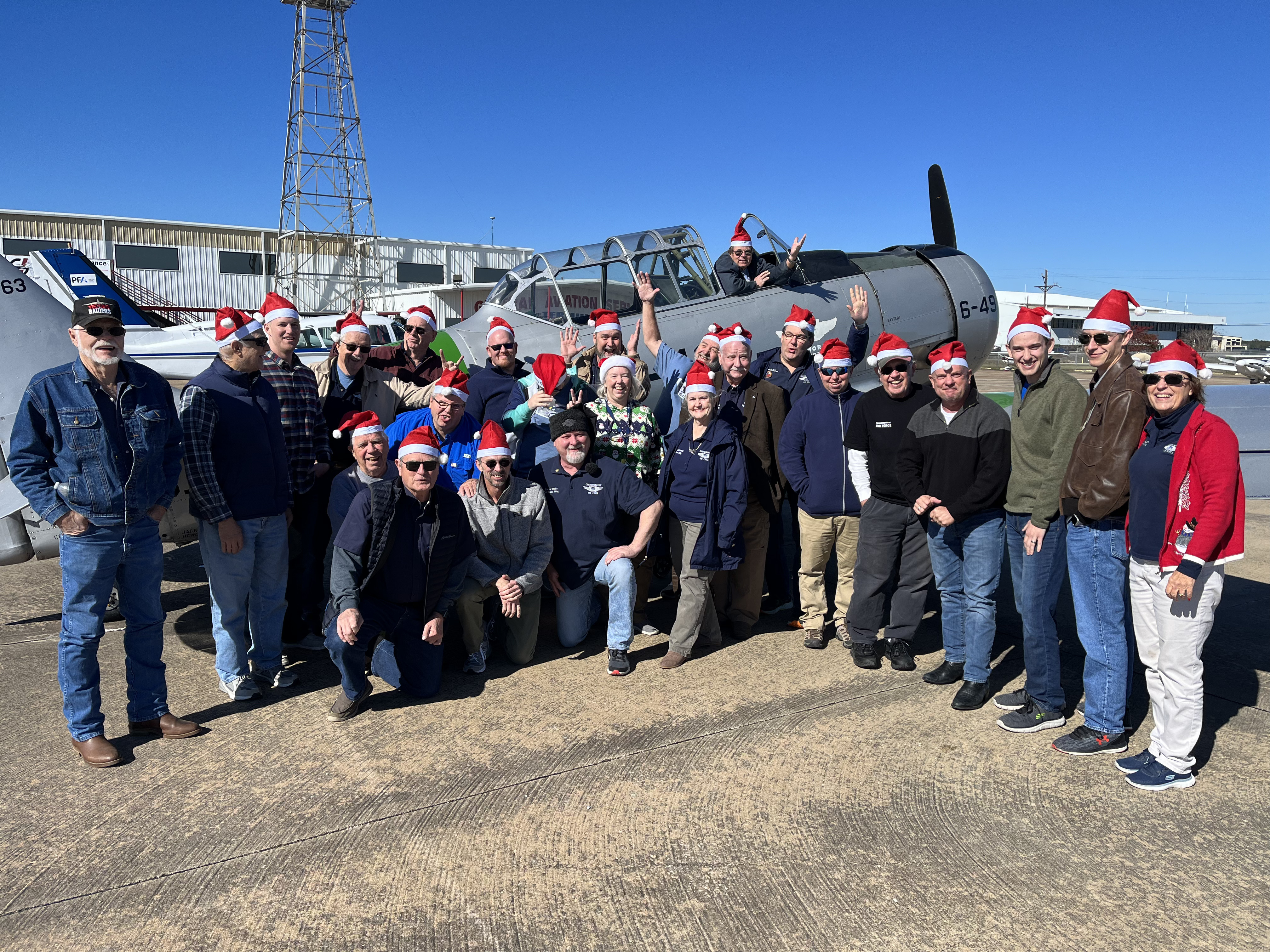 Gulf Coast Wing Crew Elves standing with the SNJ